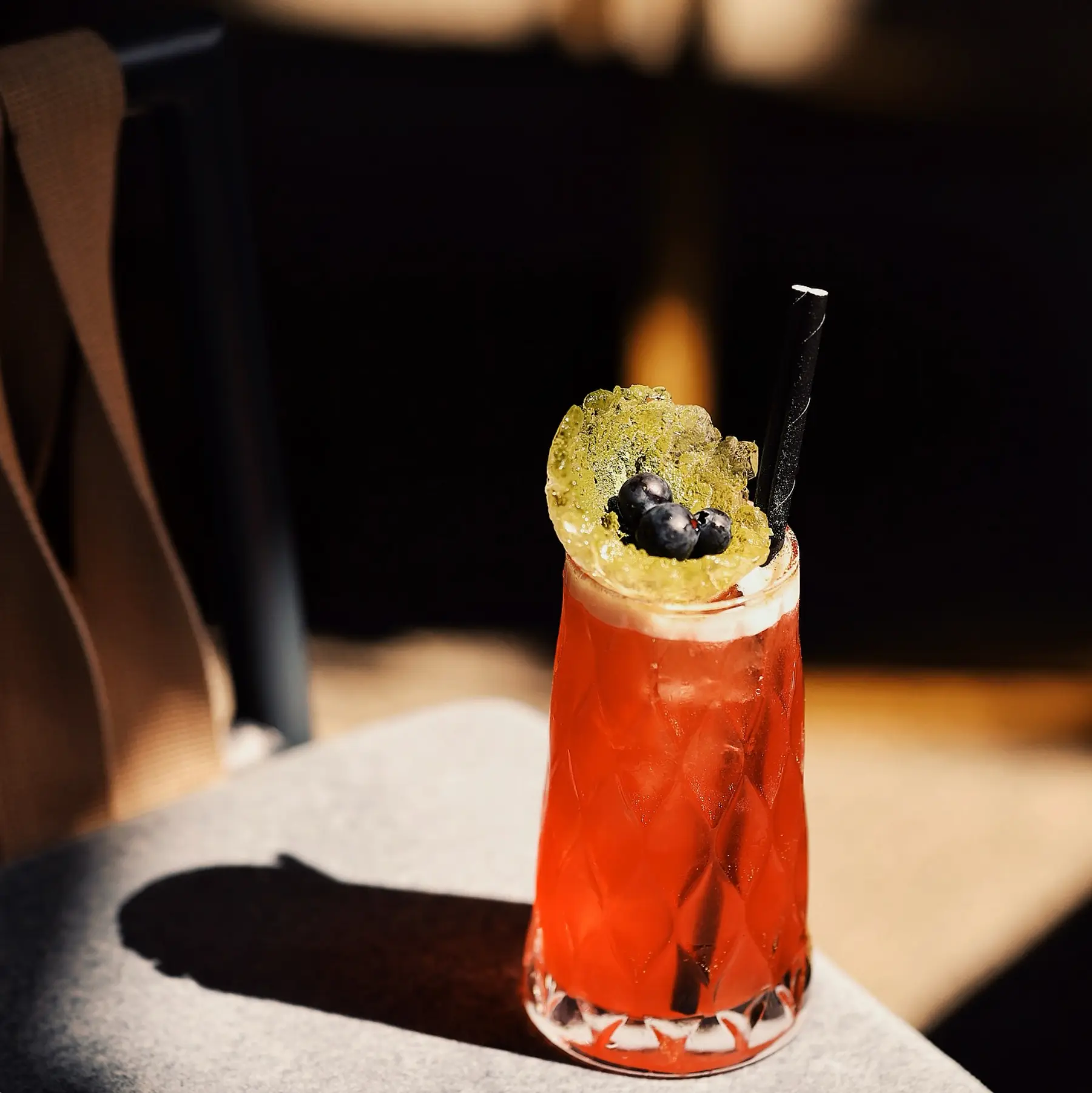 Red highball with blueberries
