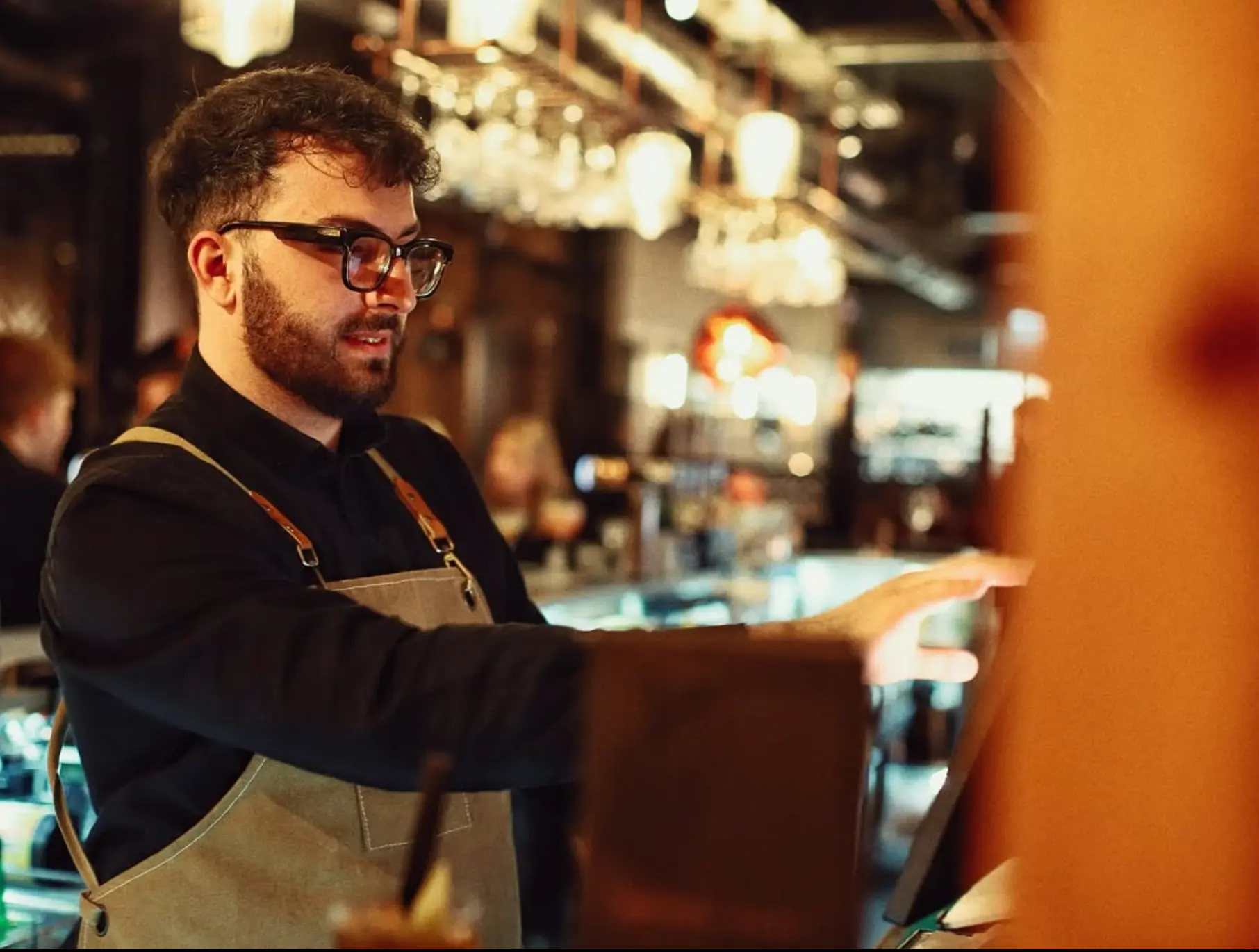 Bartender preparing a drink at the bar