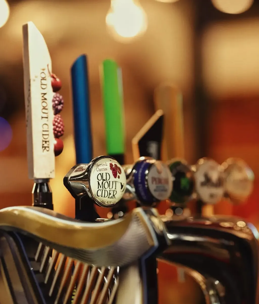 Draught beer and cider taps at the bar